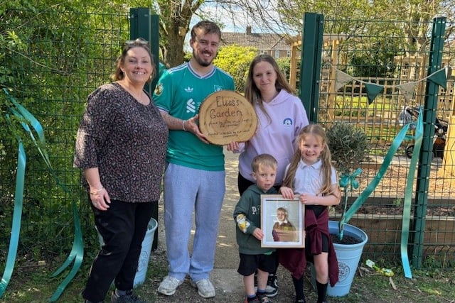 Elias' family with St Mary's headteacher Cathie Lampert at the Memory Garden unveiled in his honour.