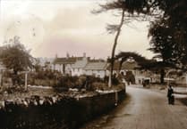 Mystery Photo: A man and his child at a crossroads but which?