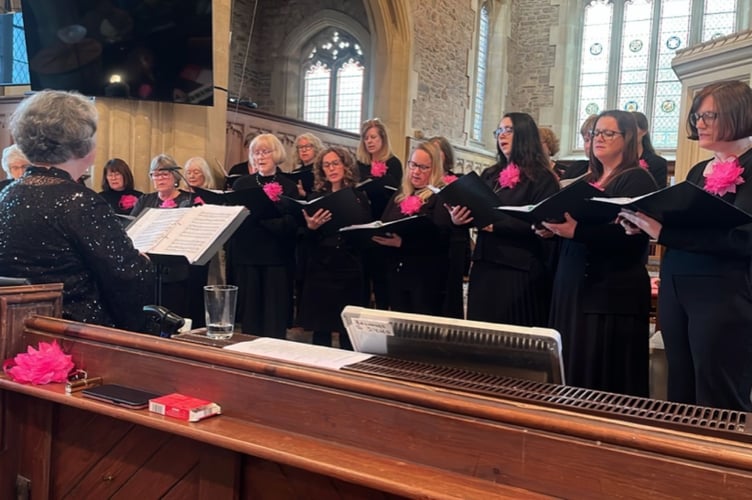 Sing Your Heart Out Community Choir in Chilcompton helping raise £500 towards St John's Church heating appeal.