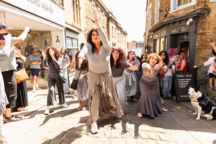 More than 100 people dressed up to take part in the sing and dance-along to Kate Bush's Running up that Hill.