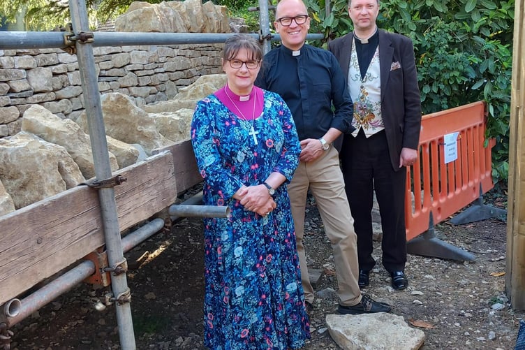 The Bishop of Taunton Right Rev Fiona Gibson viewing the rebuild of the collapsed wall at Holy Trinity Church.