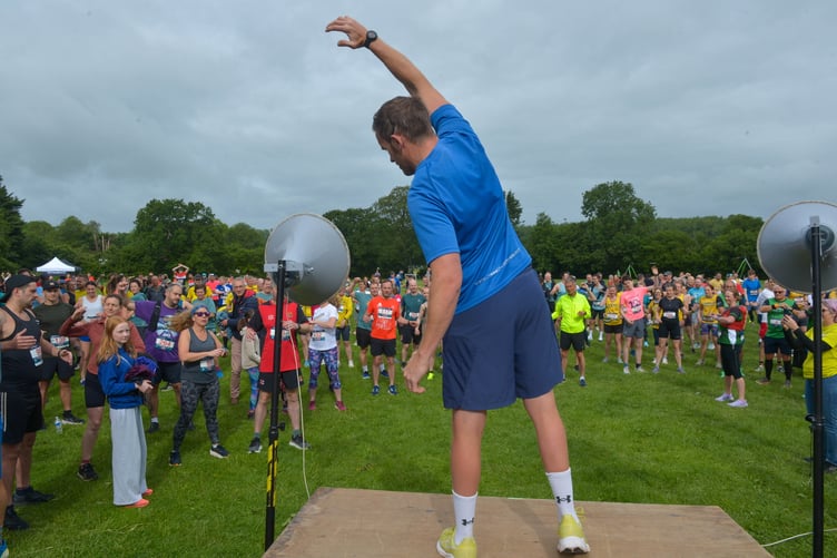The all-important pre-race warm up held by Ross Elliot prepares the strong field of 790 runners.