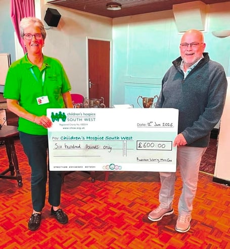 Chairman Paul Derrek presents a cheque for £600 to Children’s Hospice South West.