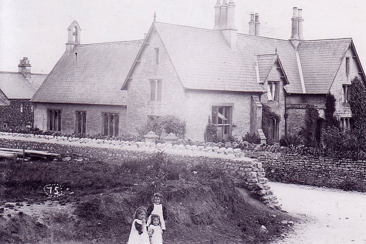 Three young girls in the foreground but what is the building behind them and where?