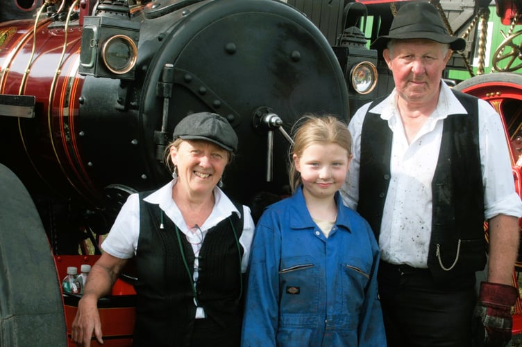 Showing off their steam power are Marcia and Tony Beeching with Amelia Haddock
