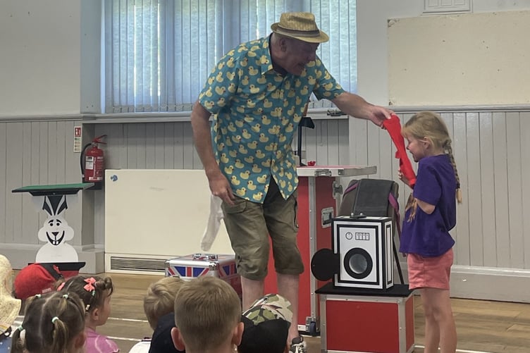 Children's entertainer Matt Magic kept the younger community members entertained in the Village Hall.