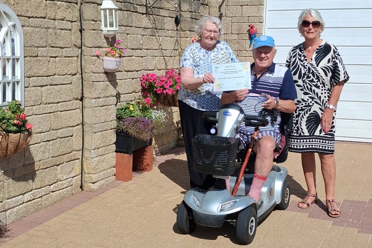 Mr and Mrs Tucker of Coxwynne Close won best in the container section for the visual impact of their display.