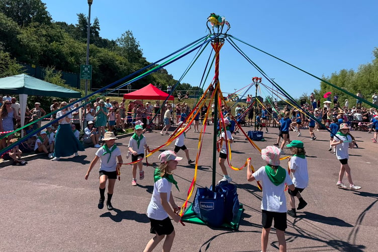 Children from local schools danced around the Maypole entertaining the crowds.
