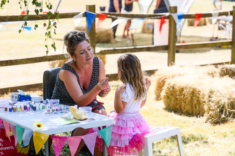 A glitter and face-painting station was an essential part of the entertainment on offer for young guests.