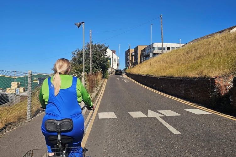 Vicki aka Team Luigi takes on a hill as during the three-day trike challenge from Brighton to Weymouth.
