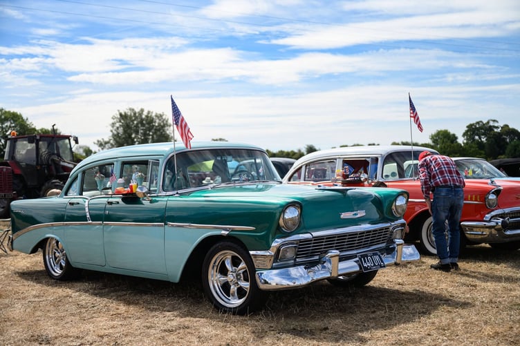 An impressive array of classic cars included this beauty complete with drive-in lunch tray.