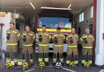Firefighters stand in silence to remember 9/11