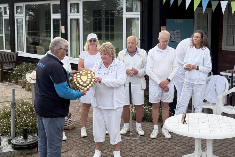Trophy presentation to Camerton and Peasedown team captain Marion Button by David Green (SW Fed of croquet clubs).