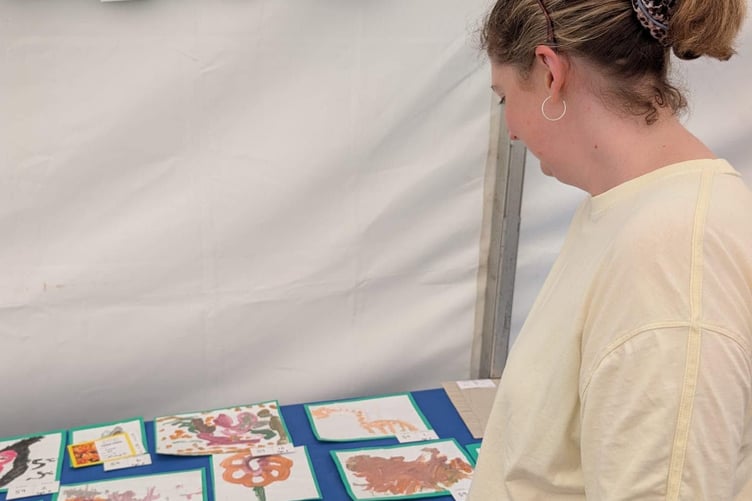 MP Anna Sabine taking time to wonder at the artwork entries from St Mary’s C of E Primary School.