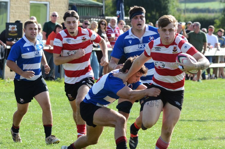 Midsomer Norton (red hoops) in action against Gordano.