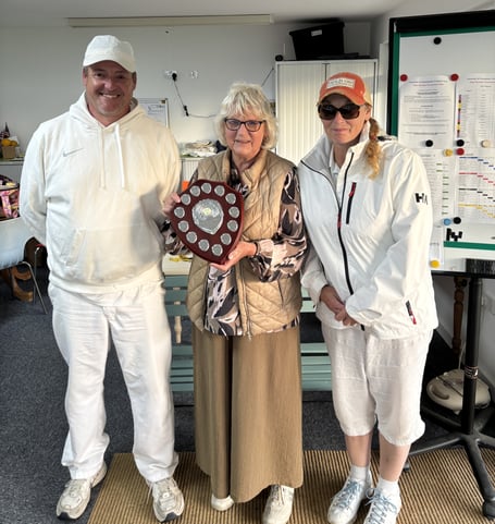 Event organiser Mo Boys presents the winner’s trophy to Stuart and Louise Smith from Budleigh Salterton CC.